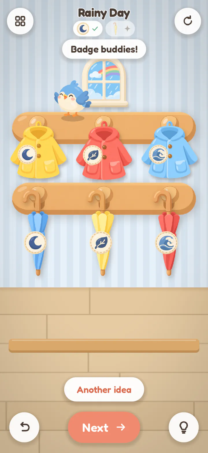 Rainy Day finished: each coat above the umbrella with the same badge, a rainbow in the window, and an Another idea button.