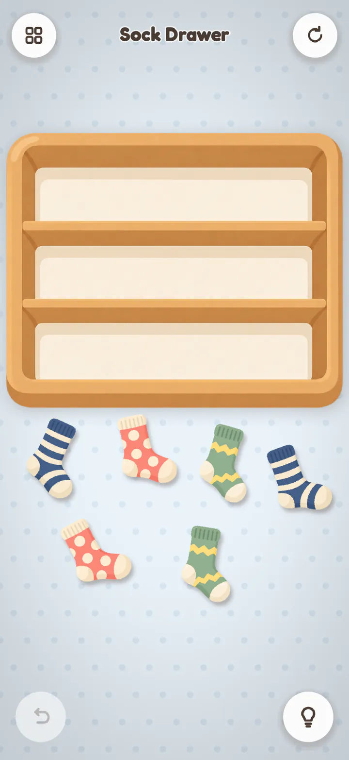 Sock Drawer as it starts: six socks scattered under an empty three-shelf drawer.