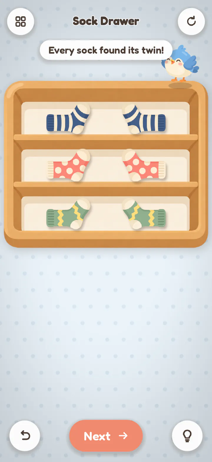 Sock Drawer finished: each sock beside its twin, one pair to a shelf, with “Every sock found its twin!” and Pip on top.